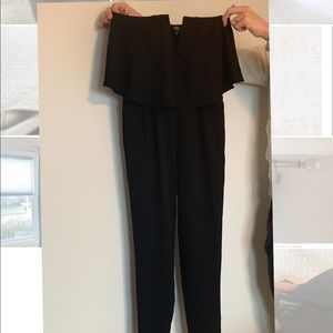 Black jumpsuit with ruffle detail